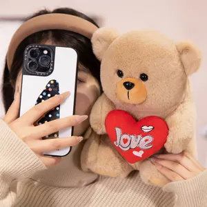 Cute teddy bear plush toy holding a red love heart, soft stuffed animal gift for holidays.