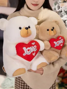 Cute plush teddy bear couple holding love hearts, soft stuffed animal toy for Valentine gift.