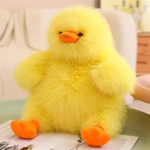 Fluffy yellow duck plush toy detail view, soft cute stuffed animal doll for kids and girls gift.