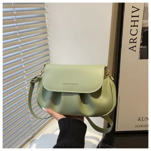 Green pleated shoulder crossbody bag for women, stylish niche saddle bag for daily commute.