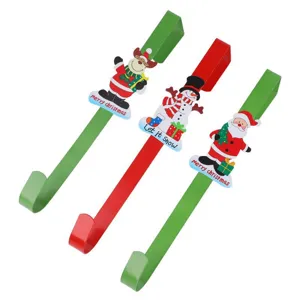 Detailed shot of Christmas metal door hooks featuring festive reindeer snowman and santa designs.