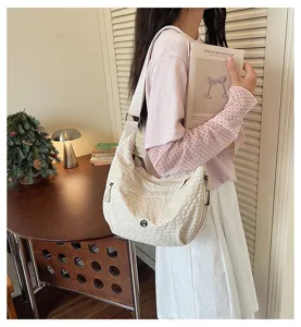 Detail view of the stylish nylon waterproof grid dumpling shoulder bag, perfect for daily use.