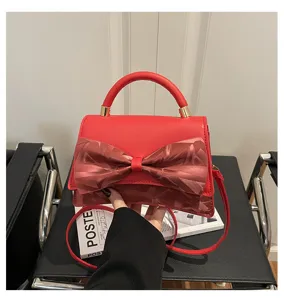 Red fashion women handbag with elegant bow detail, stylish top-handle and shoulder crossbody bag.