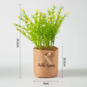 Artificial potted plant with green leaves and jute pot, Nordic home decor floral arrangement.