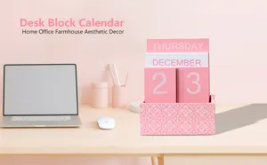 Wooden desk block calendar with pink finish, home office farmhouse aesthetic decor setup.