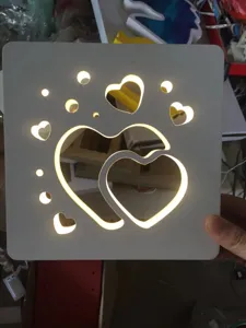 Wooden LED night light featuring hollow heart shapes, perfect for Valentine and wedding decor.