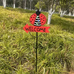 Metal ladybug garden stake with welcome sign detail, perfect for lawn and outdoor yard decoration.