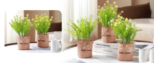 Artificial potted plant detail, burlap pot with spring flowers, home decor tabletop display.