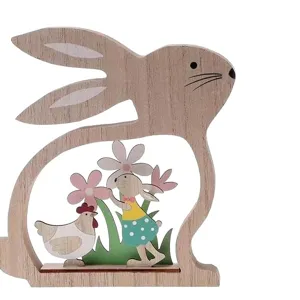 Wooden Easter bunny tabletop ornament with cute hollow chicken and flower design for decor.