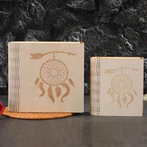 Wooden storage box detail showing intricate dreamcatcher laser engraved pattern on lid.