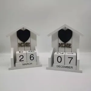 Creative wooden perpetual desk calendar with house shape, black heart decor, and date blocks.