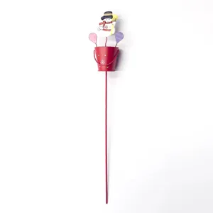 Christmas metal ground stake decoration with cute snowman and mini red bucket for holiday garden.