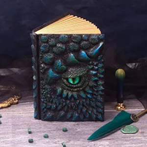 Vintage resin dragon book notebook with 3D scaled demon eye cover and aged pages for fantasy decor.