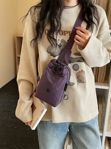 Casual purple nylon drawstring crossbody phone bag for women, daily commuting shoulder bag.