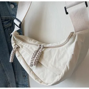 Korean style casual nylon dumpling bag with wide strap and braided zipper pulls for daily commuting.