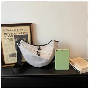 Casual nylon grid dumpling bag with large capacity, perfect for commuting and shoulder wear.