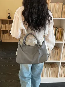 Classic grey leather shoulder bag for women, large capacity minimalist daily commute tote.