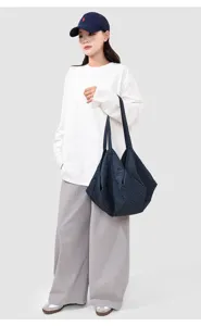 Casual plaid tote bag detail showcasing large capacity and soft fabric for daily commute.