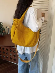 Stylish yellow nylon crossbody bag, versatile large capacity casual shoulder bag for daily use.
