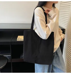 Black corduroy tote bag for women, large capacity casual shoulder bag for daily commute.