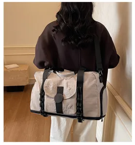 Large capacity travel duffel bag with expandable design, durable fabric and black straps for gym.