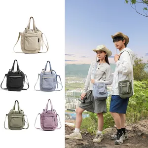 Detailed outdoor scene and color options of the versatile canvas crossbody tote bag for hiking.