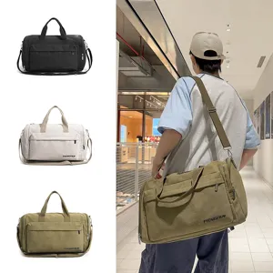 Large capacity canvas travel duffel bag for men, waterproof gym handbag and weekender.