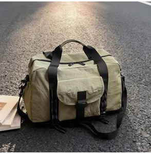 Detailed view of the large capacity travel duffel bag with durable straps and front pocket.