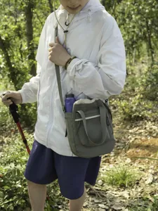 Lightweight drawstring crossbody bag outdoor hiking sports casual shoulder bag for daily travel use.
