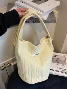 Fashionable casual quilted yellow shoulder bag, relaxed large capacity crossbody bag.