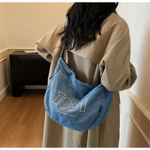 Casual denim shoulder bag with retro embroidery, large capacity daily tote for commute.