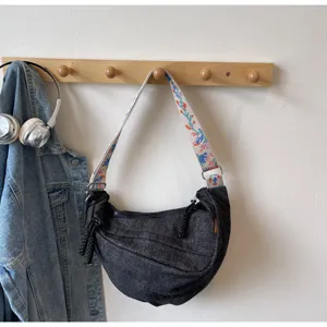 Black washed denim crescent shoulder bag with colorful embroidered strap for women street style