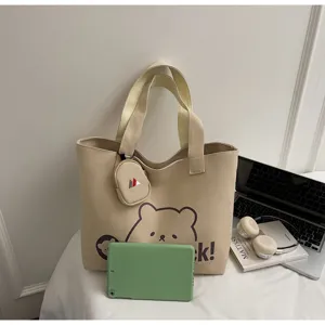 Canvas tote bag detail view, large capacity casual shoulder bag with cute bear graphic and pouch.