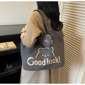 Casual canvas tote bag with cute bear print, large capacity shoulder bag for daily commute.