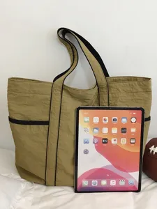 Casual khaki nylon tote bag with black straps, large capacity daily commuter shoulder bag for women.