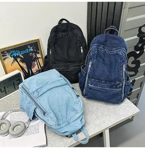 Korean style denim backpack for women, casual solid color student travel bag with multiple pockets.
