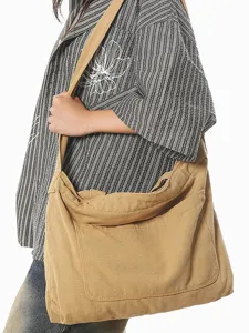 Casual canvas shoulder bag for women, large capacity crossbody hobo bag for daily commute.