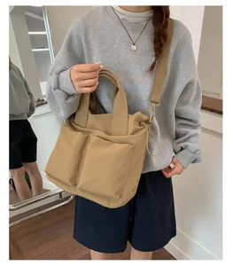 Casual nylon tote bag for women, large capacity shoulder handbag with front pockets and straps.