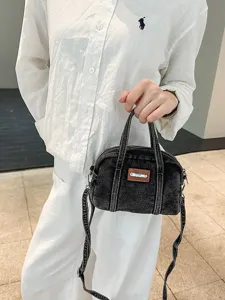 Vintage denim handbag for women, casual autumn trendy crossbody bag with top handle and strap.