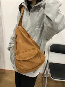 Sac bandoulière en toile marron pour femme, grand sac de poitrine pour un usage quotidien.