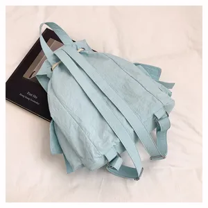 Mochila casual azul claro para mujer y estudiante, gran capacidad para viaje diario.