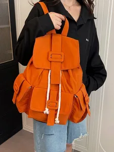 Mochila casual naranja de moda con cordones blancos y gran capacidad para uso diario y viaje.