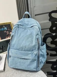 Casual light blue denim backpack for women, stylish college student small bookbag with pockets.