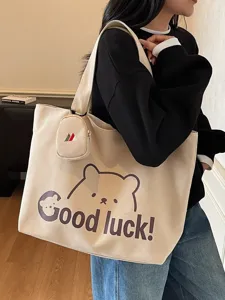 Casual canvas tote bag for women, large capacity shoulder bag for student commute travel.