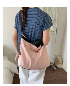 Casual pink canvas large capacity shoulder bag for daily commuting, school and casual use.