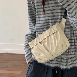 Korean style casual nylon crossbody bag, solid beige shoulder bag for women daily use.