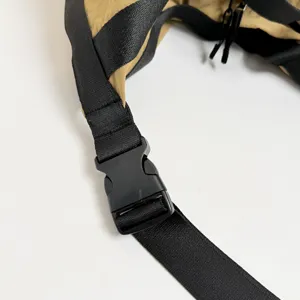 Close-up detail of stylish casual shoulder bag adjustable strap and durable plastic buckle.