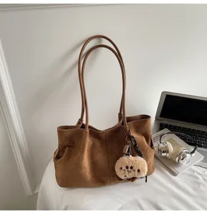 Retro brown suede shoulder tote bag, large capacity casual commuting bag with cute plush charm.