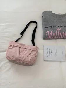 Pink nylon crossbody bag, casual vintage shoulder bag with adjustable strap for women.