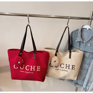 Casual canvas tote bag, large capacity shoulder bag for commuting, travel, and daily use.